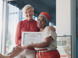 Female business owner receiving an award